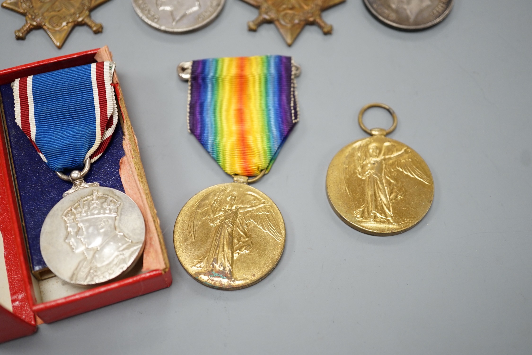 WWI and later medals - Mons star (with bar and rosette) trio to 6480 PTE. F. TURNER 1/DNS., a Mons star pair to L-8608 CPL. E.T. DYER. 1/R W. KENT R., an unnamed Great War medal and a boxed George VI coronation medal (7)